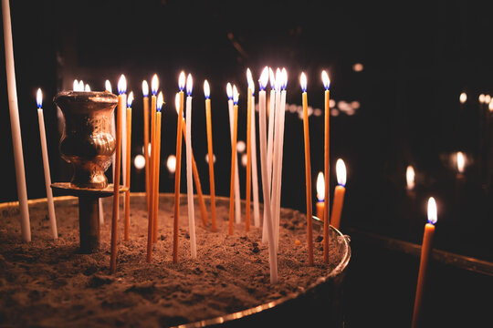 Greek Orthodox Christian Easter ceremony procession, divine worship service, worshippers hold candles, parishioners during an Easter vigil mass in a Cathedral, Athens, Attica, Greece, divine liturgy - Powered by Adobe