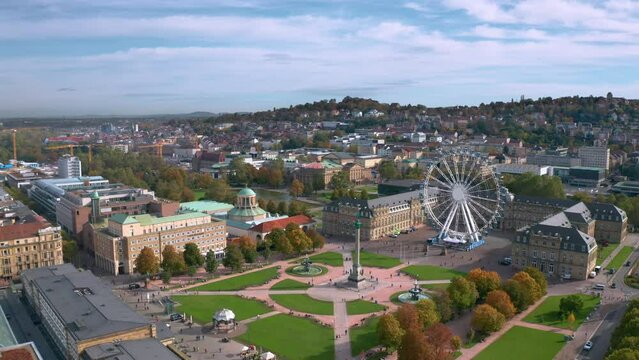 Beautiful aerial skyline cityscape of Stuttgart Mitte, Baden-w&uuml;rttemberg, Germany at sunset. Ferris wheel and Jubil&auml;umss&auml;ule at Schlossplatz in front of Neues schloss