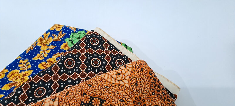 folding jarik or traditional Indonesian batik cloth isolated on white background. Javanese tradisional cloth