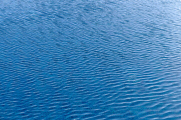 Ripple Water in swimming pool with sun reflection 2