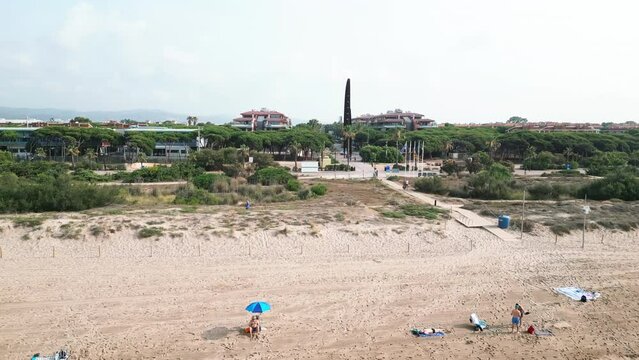 Aerial video of Gav Spain coastline and people vacationing. near Barcelona Spain