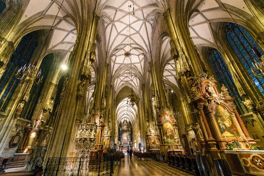 The ornate Gothic interior of the 14th century St. Stephen's Cathedral in Vienna, Austria.