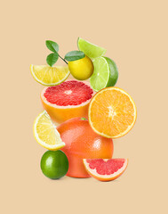 Stack of different citrus fruits on beige background