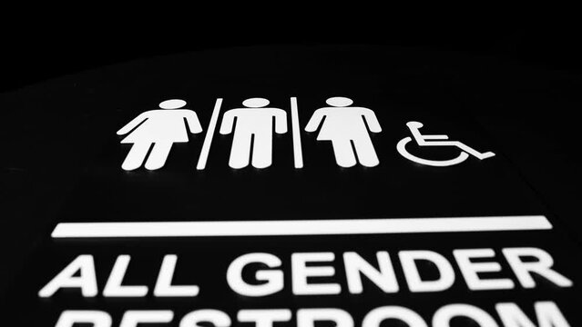 All gender restroom sign on dark background