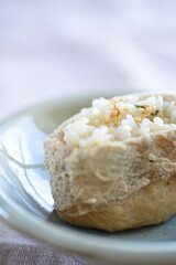 Inarizushi is a traditional sushi using vinegar rice tucked inside a sweet and salty deep-fried tofu envelope.