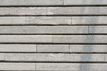 textura de muro de bloques grises con división de líneas