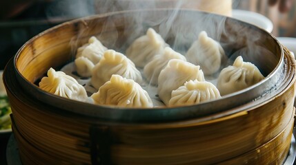 Hot and delicious steamed xialongbao served with Bamboo basket in asian chinese restaurant