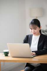 Japanese businesswoman operating a computer