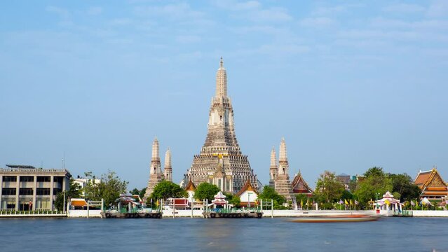 Pagoda at Wat Arun, a royal temple at Chaopraya river in Bangkok, Thailand. Time lapse video on a sunny day.
