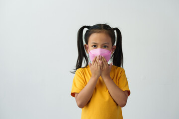Little Asian girl wears a mask to help her breathe and protect her from dust, smoke, PM2.5, virus...