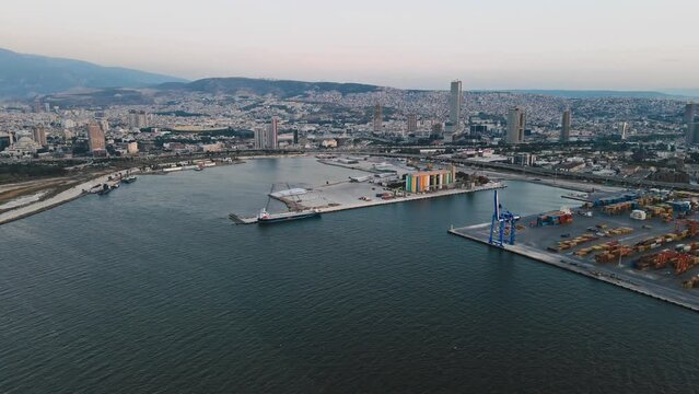 Drone shot of industrial port with containers, aerial view. Import and export cargo port where is a part of shipping dock