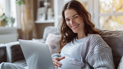 pregnancy, technology, people and expectation concept - happy pregnant woman with laptop and - obrazy, fototapety, plakaty