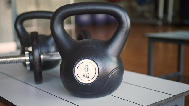 Gym Equipment or Dumbbell Kettlebell in a gym bench 