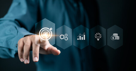 Business target concept. Person touching target icon on virtual screen for business strategy and...