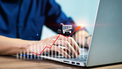 Sale growth concept. Businessman touching graph of increase in sales volume with shopping cart on...