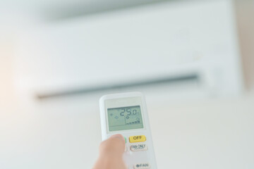 hand operating remote controller for adjust Air conditioner inside the room of office or house