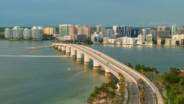 Above view of Sarasota city, Florida with waterfront office highrise buildings and John Ringling Causeway leading from downtown to St. Armands Key. Development of housing and transportation in the US