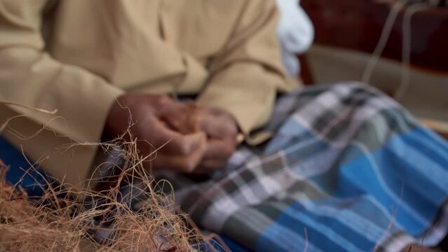 Making rope from natural palm tree fiber