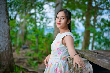 Naklejka premium Portrait of a young Asian girl in the park
