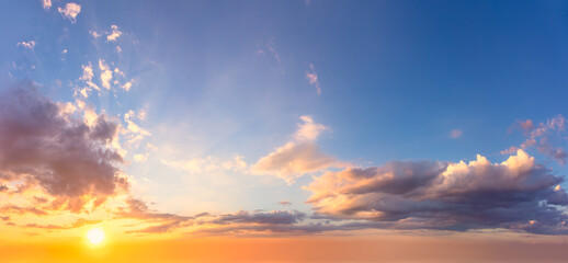 Amazing real sky - Gentle colors Panoramic Sunrise Sundown Sanset Sky with colorful clouds. Without any birds. Large panoramic sky with sun. - obrazy, fototapety, plakaty
