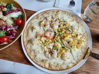 a pizza topped with seafood