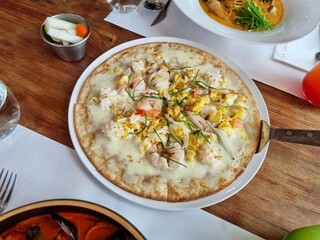 a pizza topped with seafood