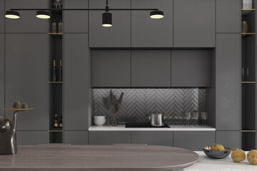 Interior design of luxury gray kitchen background, empty wooden cooking island with blurred kitchen wall, modern design ceiling light in black, elegant dining room and kitchenware, 3d rendering