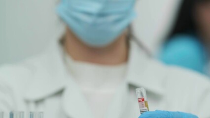 Female scientist using a micropipette for analysis in a modern laboratory. Advanced scientific laboratory of medicine and biotechnology development. Close-up