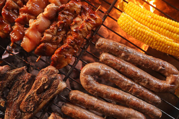 South African braai including Boerewors sausage, chicken kebabs and lamb chops with mielies or corn on the cob 