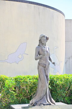 A close-up of the Teresa Teng Memorial Statue at Luzhou MRT Station in Sunlight Park during the day.
