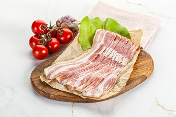 Sliced pork bacon oved board