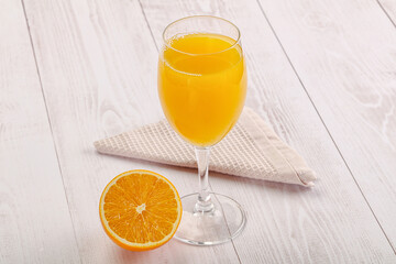 Sweet fresh orange juice in the glass