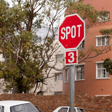 Road, city and outdoor with stop sign, mistake or typo for humor with comic text in neighborhood. Spot, error and joke with funny signage with writing, language or wrong spelling for warning in town