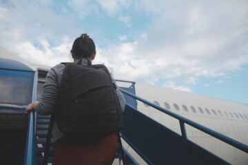 Happy attractive asian woman traveler with backpack at the modern airport terminal, copy space, Tourist journey trip concept