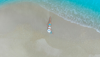 Fresh of summer with young woman relaxation  as lying on the beach  in Maldives