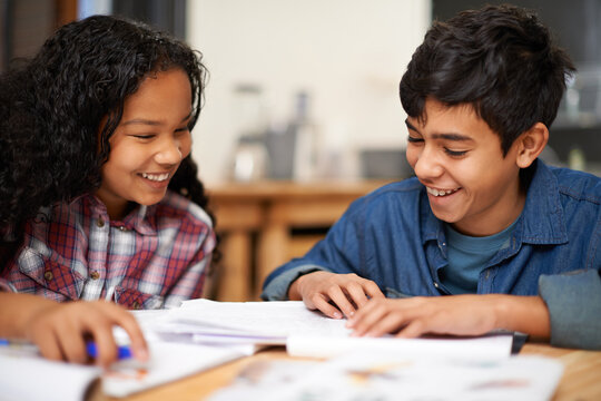 Children, homework and classroom teamwork for education assignment together for lesson, learning collaboration. Boy, girl and school student for project brainstorming with smile, creative or academy