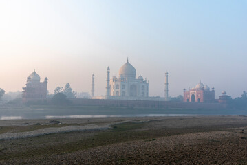 Fototapeta premium Taj Mahal mausoleum as seen from the banks of Yamuna river in Agra, Uttar Pradesh, India.