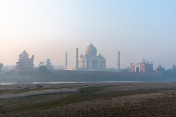 Taj Mahal mausoleum as seen from the banks of Yamuna river in Agra, Uttar Pradesh, India.