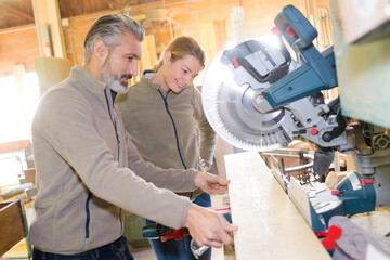 woodworker slicing a piece of timber