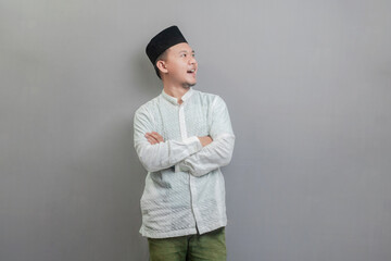 Asian Muslim man standing with crossed arm