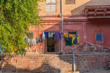 Fototapeta na wymiar Laundry in front of a old building at old Jodhpur city.