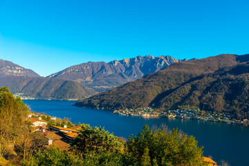 Panoramic View over Lake Lugano and Village with Mountain in a Sunny Day in Vico Morcote, Ticino in Switzerland.