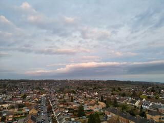 Fototapeta na wymiar Aerial View of Residential Homes During Orange Sunset over England UK