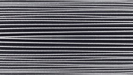 Horizontal Lines Of Black Pleated Textile Showcasing Repetitive Texture And Depth. The Photo Is...