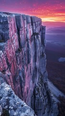 Dramatic escarpment at dusk, with vibrant hues painting the sky and rugged cliffs offering a view...