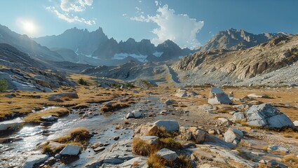 A rugged moraine field, with scattered boulders and ice remnants, leading up to a sharp mountain crest - obrazy, fototapety, plakaty