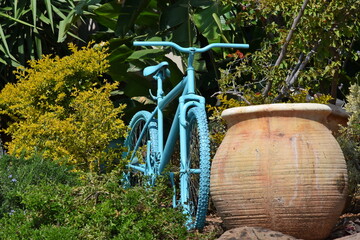 old painted bicycle in the garden for decoration