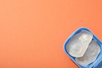 Contact lenses for eyes with a container for their storage