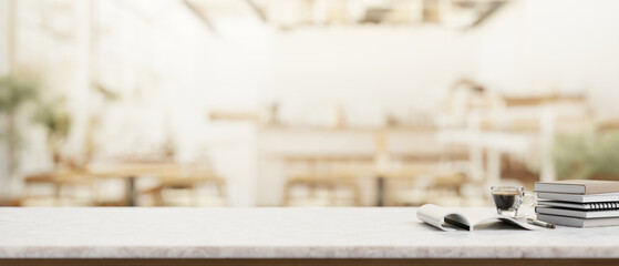 A presentation space for display products on a white table with a blurred background of a cafe.