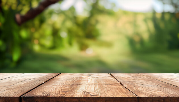 Empty wooden tabletop on a natural background. image for presentation or advertisement